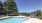 Pool with sundeck facing the mountains and trees