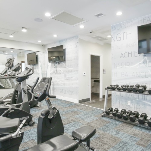 Fitness center with workout equipment and weights