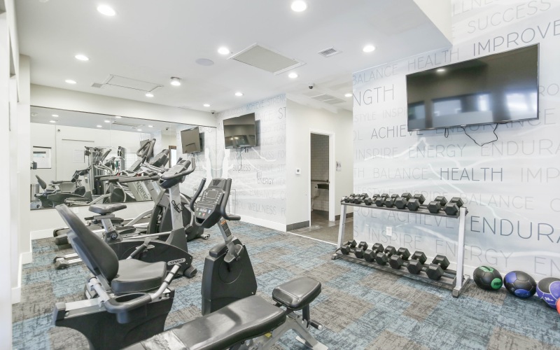 Fitness center with workout equipment and weights