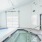 Indoor hot tub facing garage door