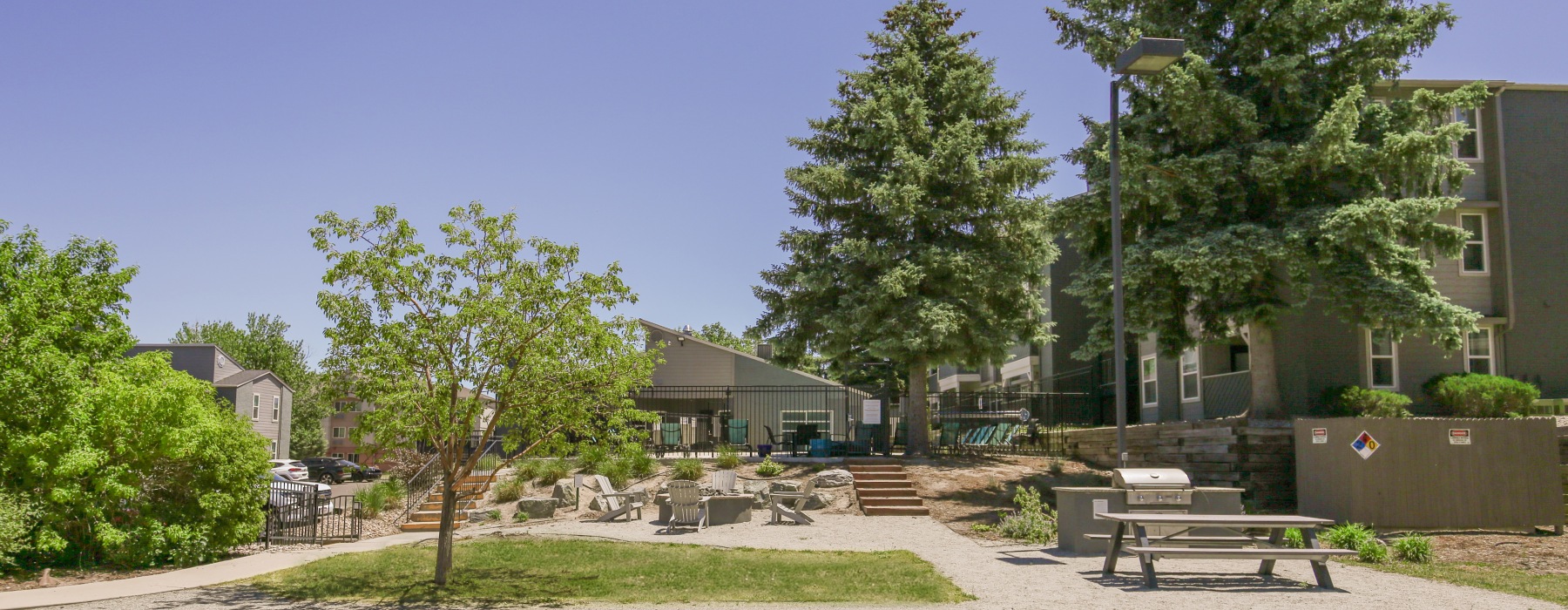 Outdoor amenity space surrounded by trees