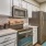 a kitchen with white cabinets