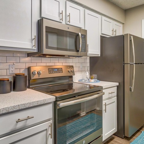 a kitchen with white cabinets